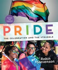 A group of diverse young people smile in sunglasses under a pride flag