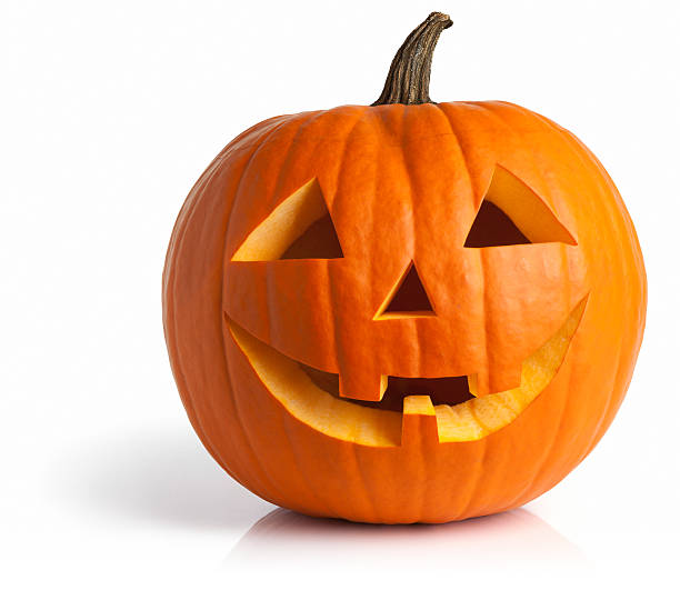 real pumpkin carved with two eyes, nose, and a smile