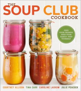 5 clear glass jars with various soups