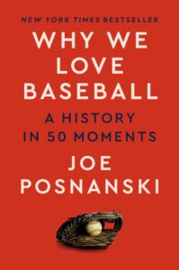red cover with a baseball glove and ball