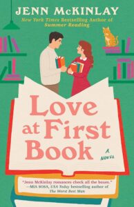 Man and woman engage in conversation with book propped open on the cover