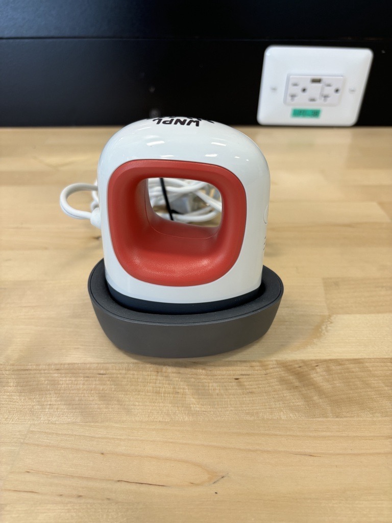 Cricut Mini press. A small iron to apply designs using heat to fabric.