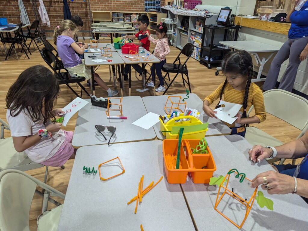 Library visits with partners Gurnee Park District at children after school program making crafts.