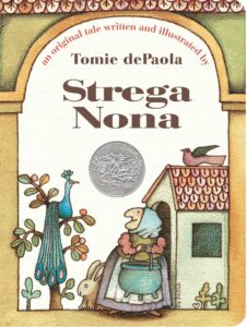 The cover of “Strega Nona : an original tale” by Tomie DePaola. Through a drawn archway of a house, there is an old woman who stands carrying a cauldron. There is a bunny behind her, a peacock in a tree to her right and a bird sitting atop a small house on her left. 