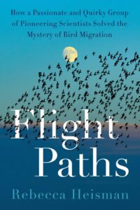 The cover of “Flight Paths : How a passionate and quirky group of pioneering scientists solved the mystery of bird migration” by Rebecca Heisman. A flock of black birds flies against an early night sky with a Waxing Gibbous moon shining brightly above them. Part of the flock overlies the white title.