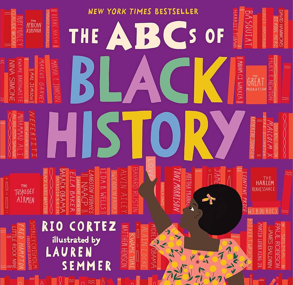 An image of the book cover for “The ABCs of Black History” by Rio Cortez. A young drawn black girl grabs a book from a large bookshelf.