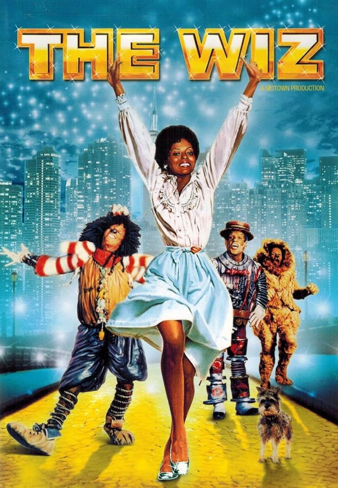 Movie poster for The Wiz, showing Dorothy, the Scarecrow, Tin Man, and Cowardly Lion, with vibrant, colorful graphics and city lights.