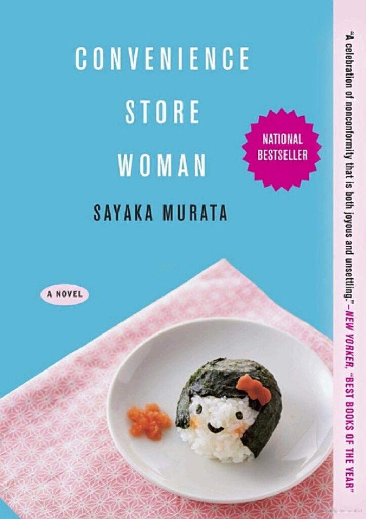 A blue background with a pink and white pattern cloth. On the cloth there is a small white plate with a rice ball that is decorated with food to look like a girl. A small star also made out of food accents the plate besides the rice ball. 