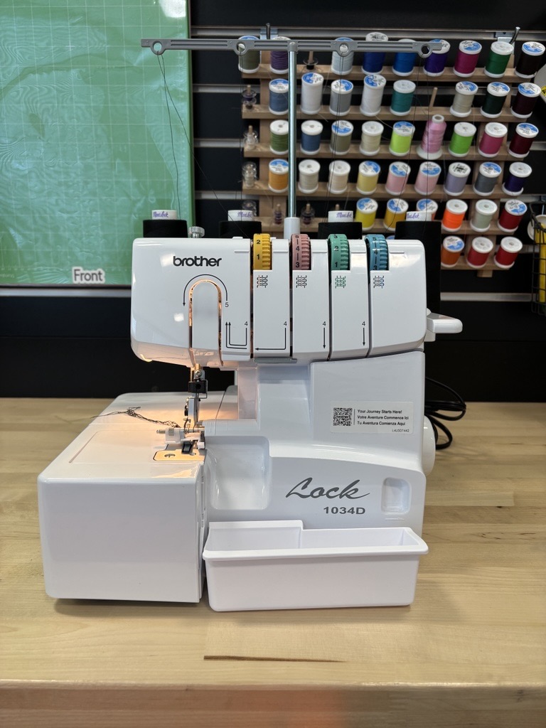 White machine with different stitch colors.