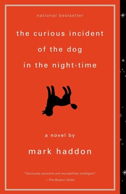 Red cover with a silhouette of a dog upside down.