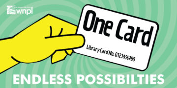 Endless possibilities with a library card. Hand holding a library card.